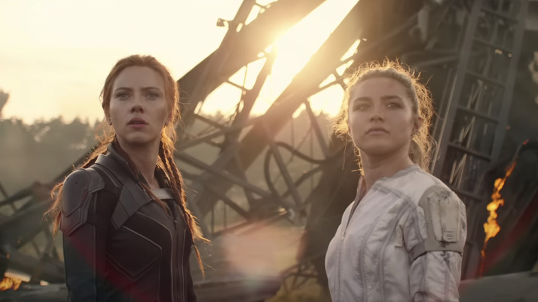 Scarlett Johansson and Florence Pugh looking away