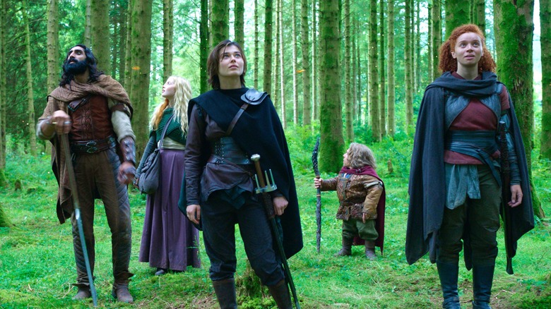 Amar Chadha-Petal, Ellie Bamber, Ruby Cruz, Warwick Davis, and Erin Kellyman standing in a forest in Willow