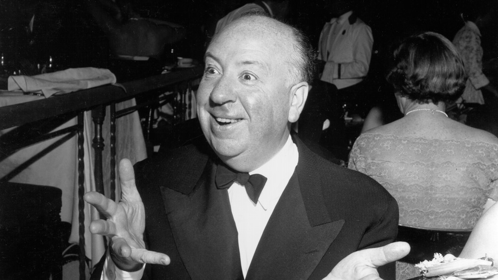 Alfred Hitchcock smiling