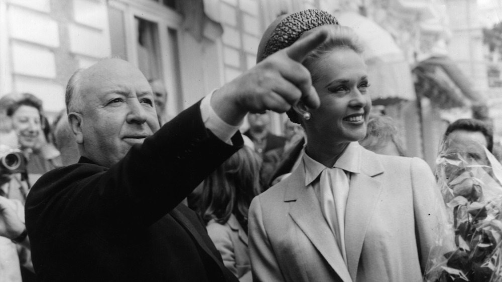 Alfred Hitchcock and Tippi Hedren.