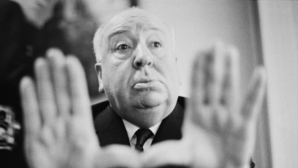 Alfred Hitchcock making a frame