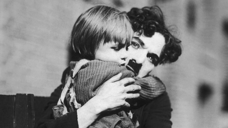 Charlie Chaplin hugging Jackie Cooper