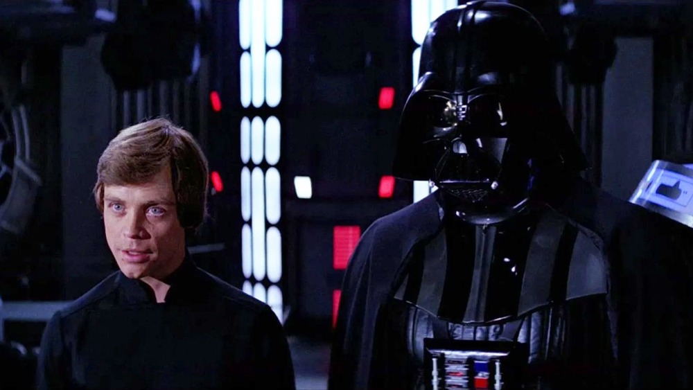 Luke Skywalker stands with Vader