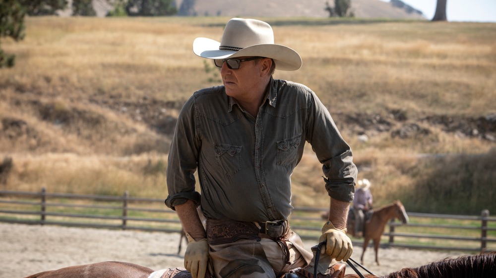 Kevin Costner riding a horse