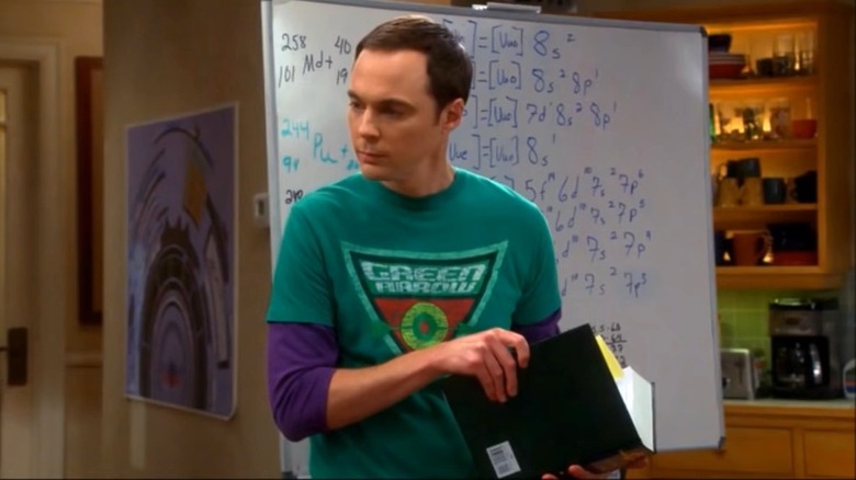 Sheldon next to whiteboard