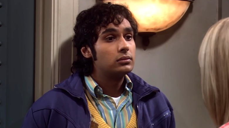 Raj Koothrappali standing against wall