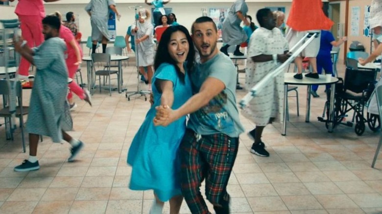 Kimiko and Frenchie dancing in crowded cafeteria