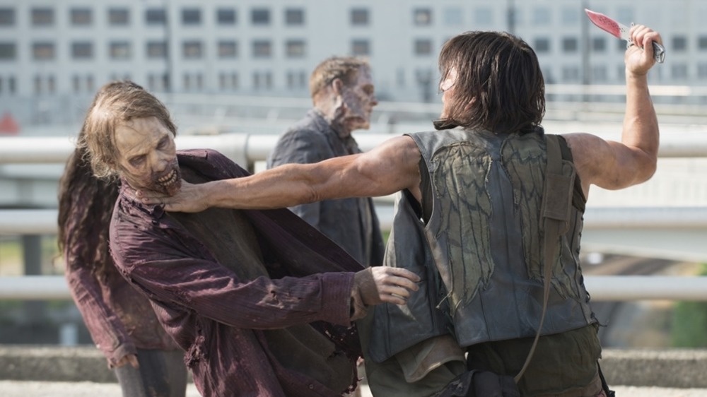 Daryl stabbing walker