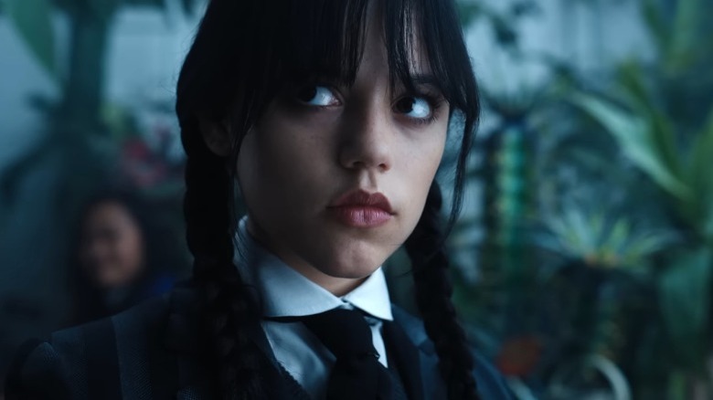 Wednesday Addams looking to her right