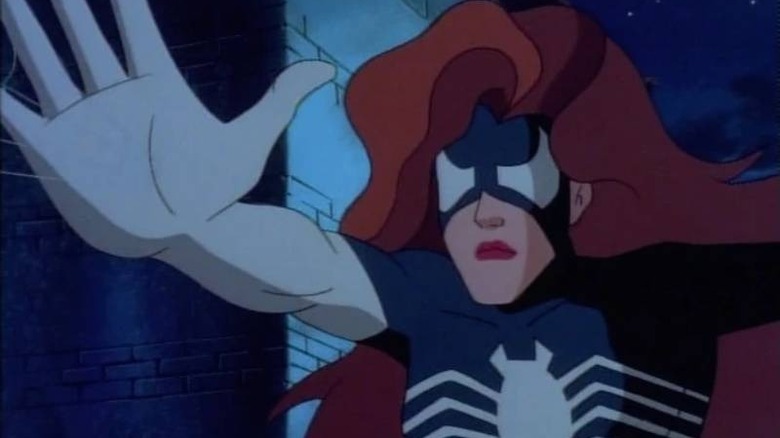 Spider-Woman halting someone