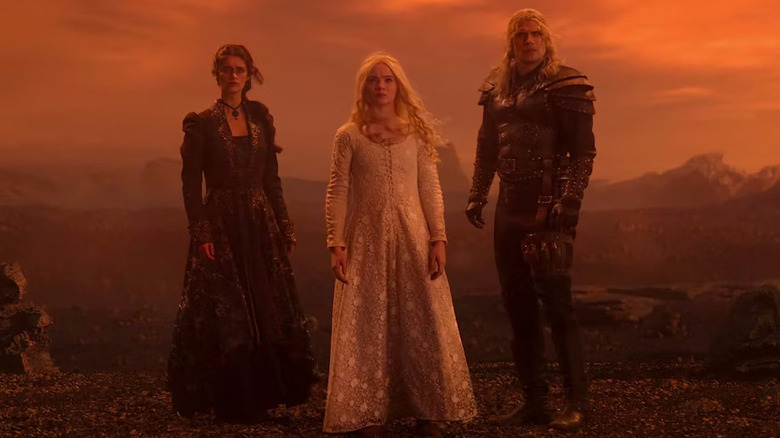 Yennefer, Ciri, and Geralt in red desert