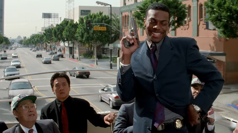 Chris Tucker posing with gun