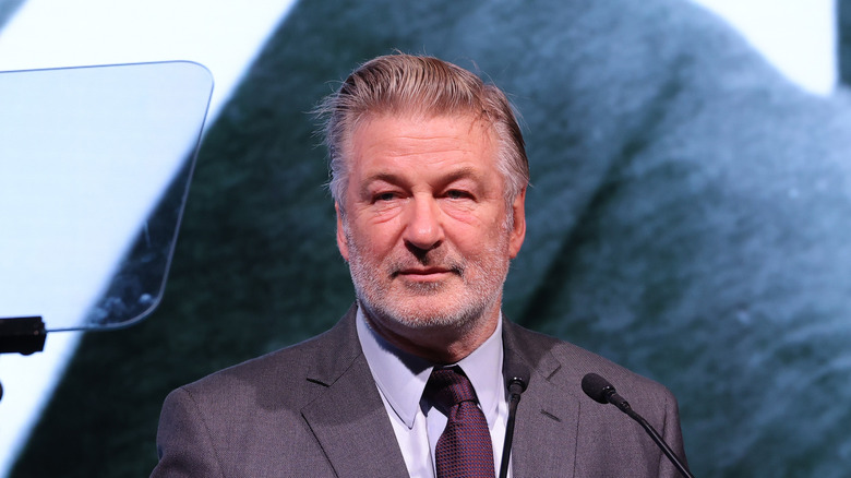 Alec Baldwin on a podium