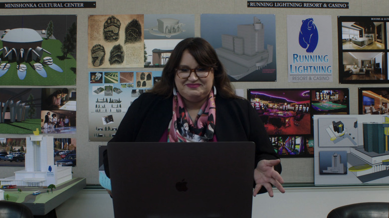 Jana Schmieding smiles at a laptop