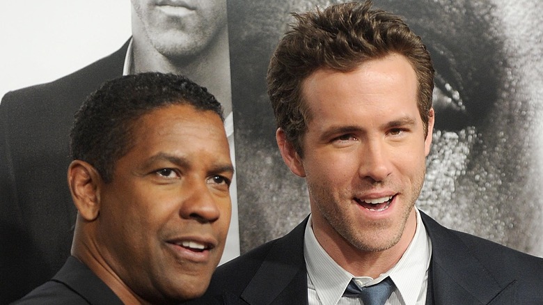 Denzel Washington and Ryan Reynolds smiling