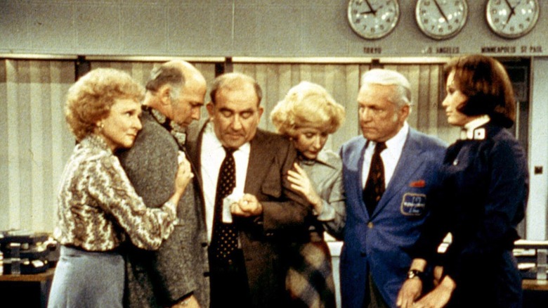 Mary Tyler Moore cast huddles together