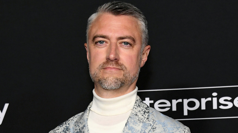 Sean Gunn wears a turtleneck