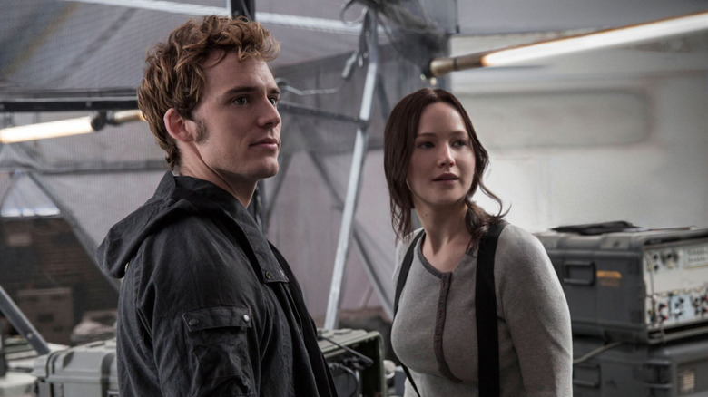 Finnick and Katniss looking