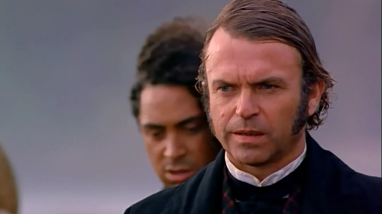 Sam Neill stands in the wind