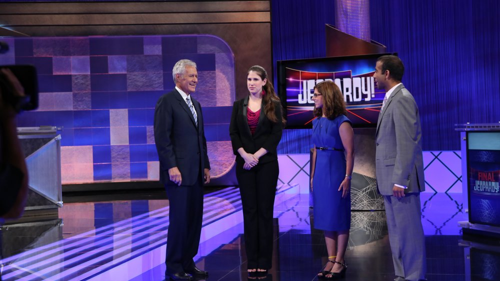 Alex Trebek and contestants on Jeopardy!