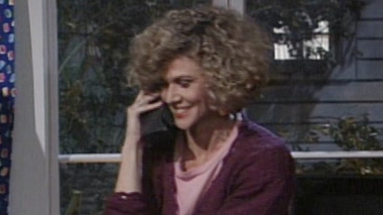 Melody Rogers smiling on the phone