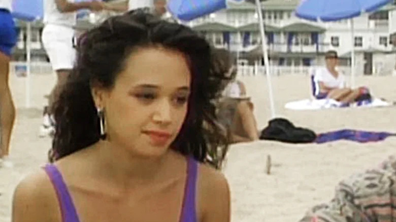 Leah Remini seated at the beach