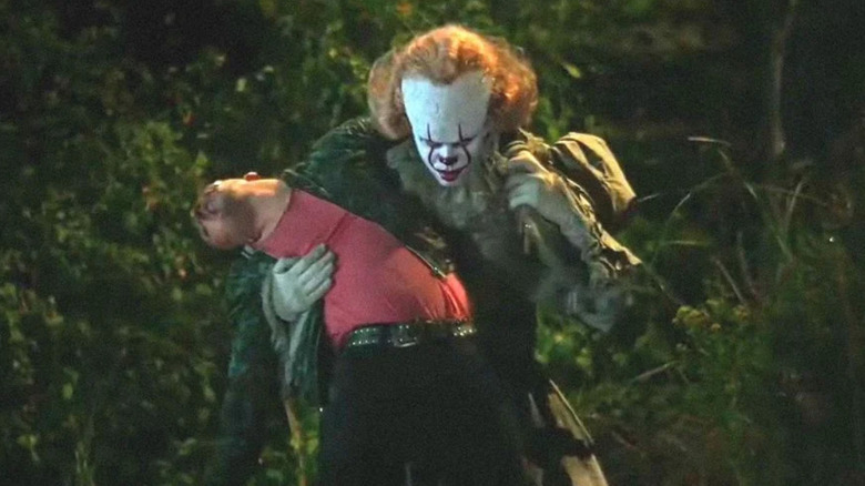 Pennywise holding Adrian