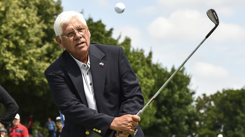 Lee Trevino hitting a golf ball