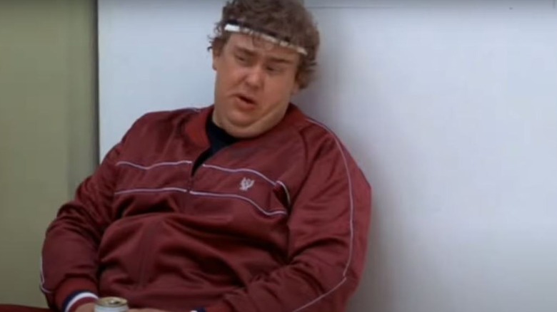 John Candy sitting down