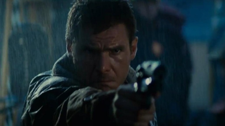 Deckard holding a handgun