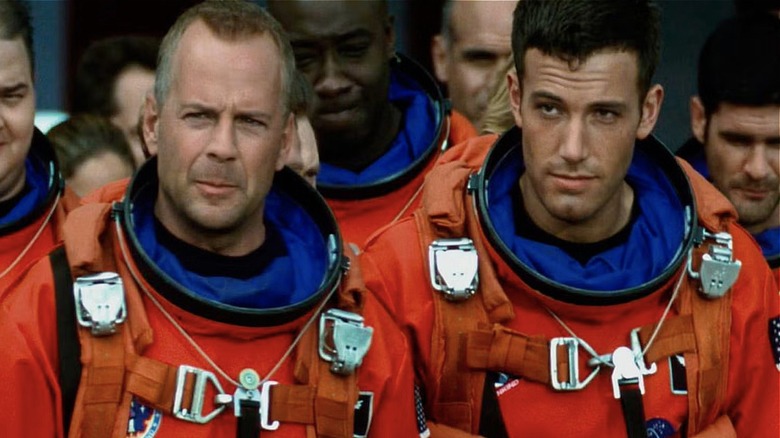 Harry Stamper, A.J. Frost, and the other astronauts congregate in "Armageddon" (1998)