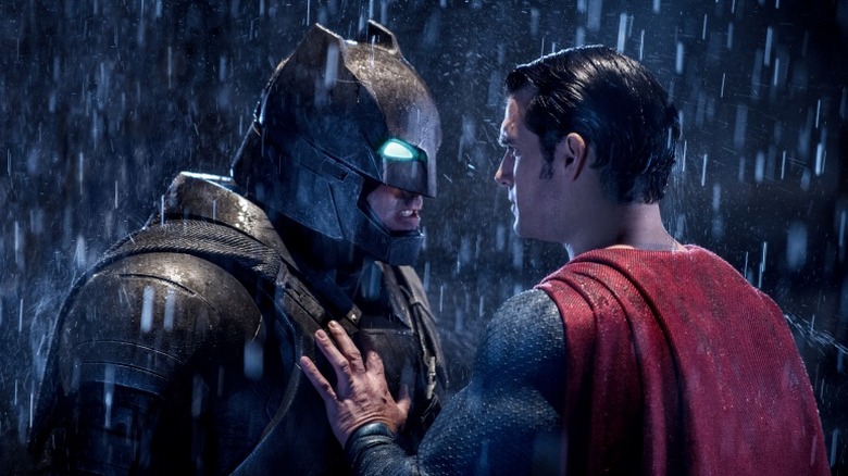 Batman faces off against Superman in the rain in "Batman v Superman: Dawn of Justice" (2016)