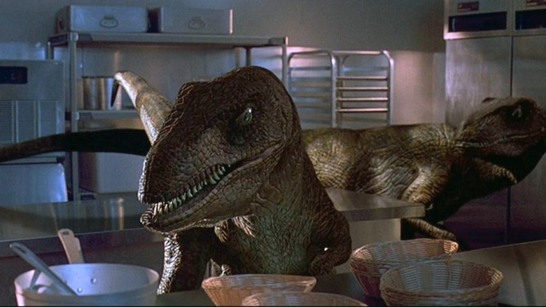 Velociraptors searching in kitchen