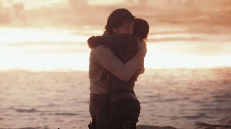 Cassian and Jyn embrace