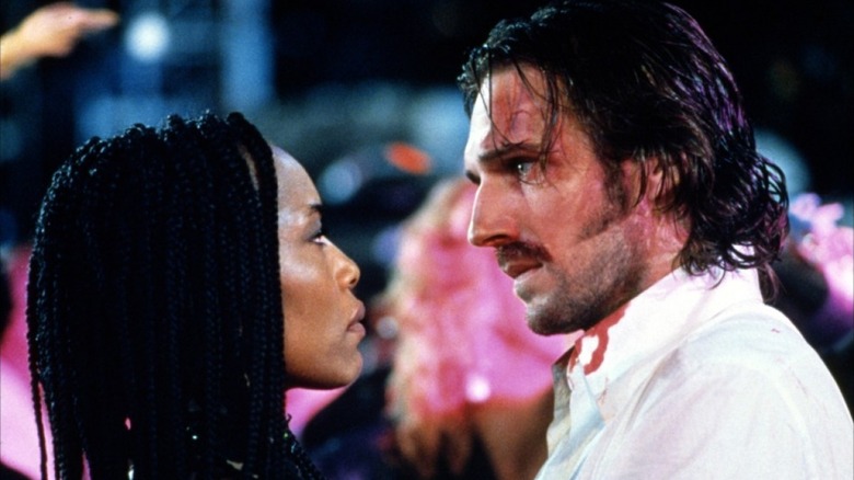 Angela Bassett staring into Ralph Fiennes eyes