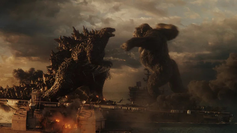 Godzilla and Kong fighting on an aircraft carrier