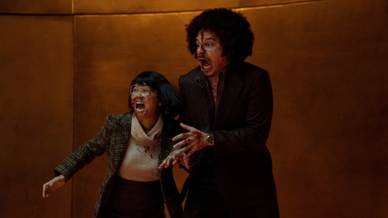 Eric André and Charlyne Yi covered in blood