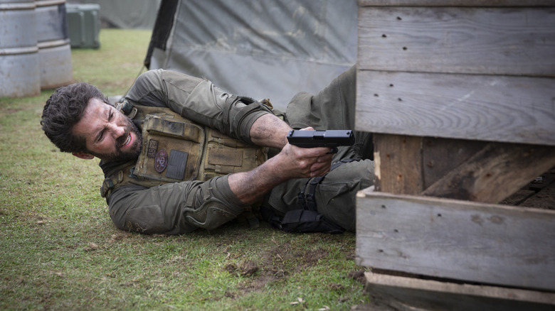 Scott Adkins on ground holding gun as Jake Harris in One Shot