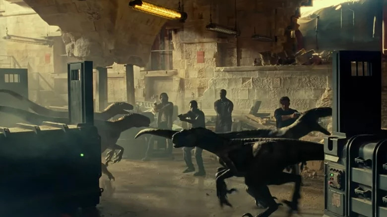 Humans facing raptors in Jurassic World Dominion 