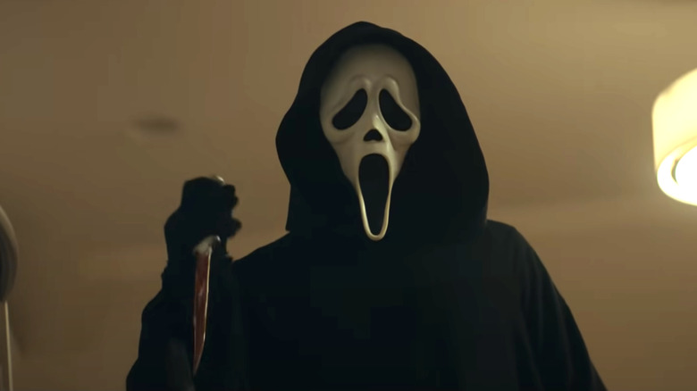 Ghostface holding bloody knife