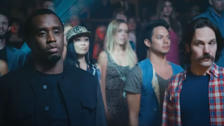 Sean Combs, Paul Rudd, and other people are standing in attention