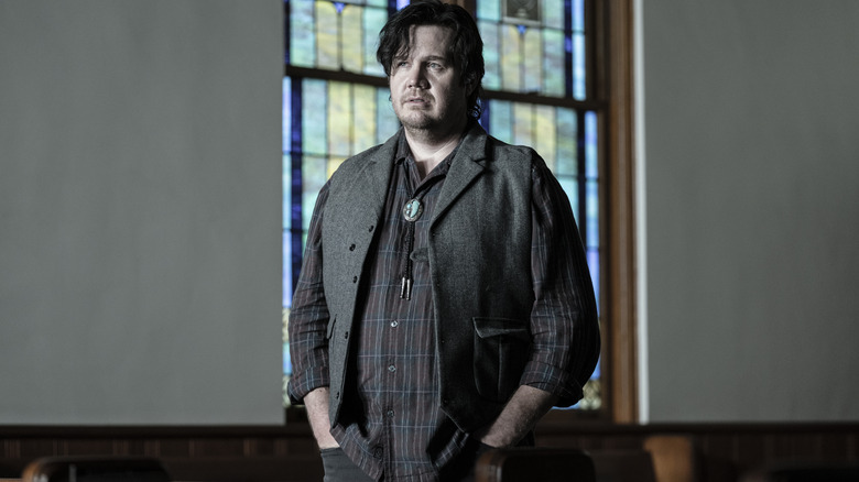 Eugene Porter wearing a bolo tie