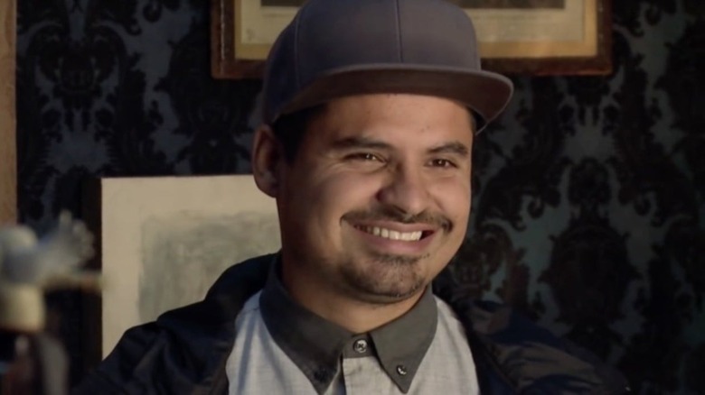 Luis smiling with a hat