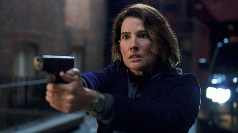 Maria Hill holding gun