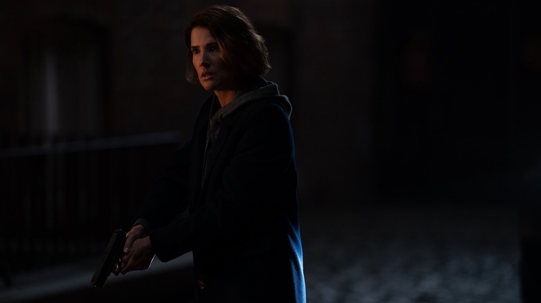 Maria Hill holding gun