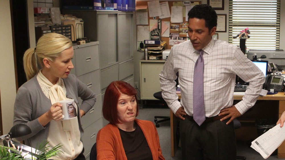 Kate Flannery as Meredith Palmer, Angela Kinsey as Angela Martin, and Oscar Nunez and Oscar Martinez in The Office