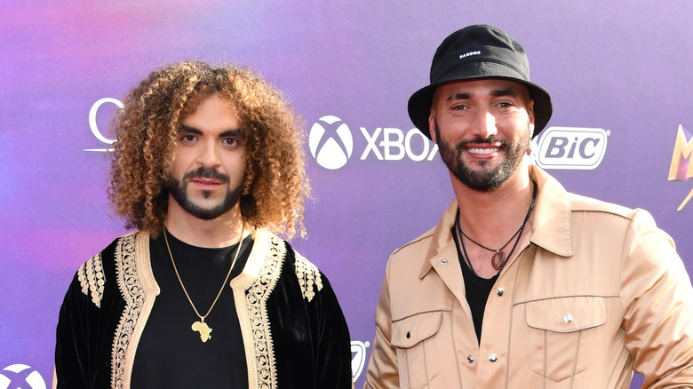 Adil El Arbi and Bilall Fallah stand on red carpet