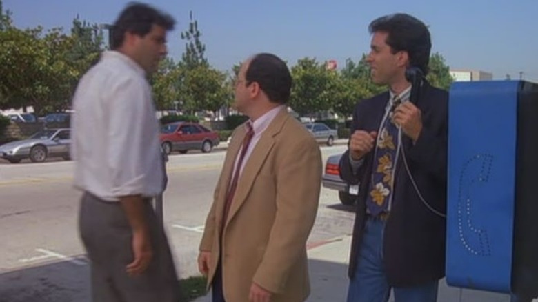 Jerry Seinfeld and George Costanza at a payphone