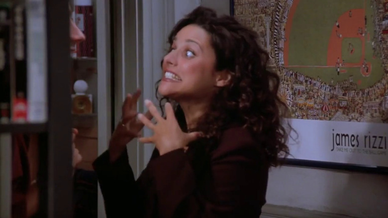 Elaine bearing her teeth