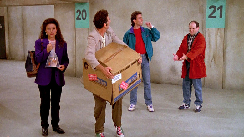 Elaine, Kramer, Jerry, and George in a parking garage